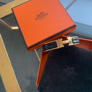 Authentic! Hermès clic h PM in black and gold